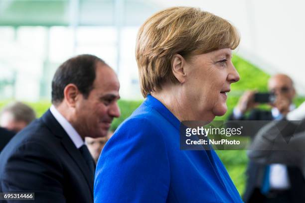 German Chancellor Angela Merkel greets Egyptian President Abdel Fattah al-Sisi upon his arrival at the Chancellery in Berlin, Germany on June 12,...