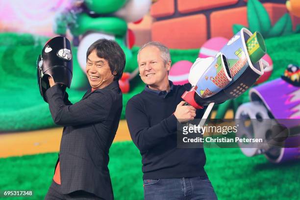 Nintendo co-Representative Director and Creative Fellow Shigeru Miyamoto and Ubisoft Co-founder and CEO Yves Guillemot pose together on stage during...