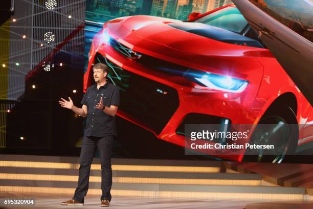 Game Director Stephane Beley unveils 'The Crew 2' during the Ubisoft E3 conference at the Orpheum Theater on June 12, 2017 in Los Angeles,...