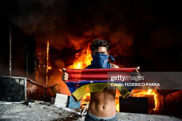 Anti-government demonstrators attack the administration headquarters of the Supreme Court of Justice as part of protests against President Nicolas...