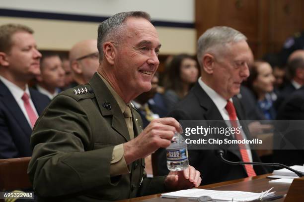 Chairman of the Joint Chiefs of Staff USMC Gen. Joseph Dunford and U.S. Defense Secretary James Mattis prepare to testify before the House Armed...