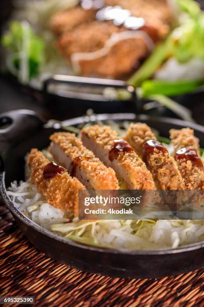 panko crusted crispy pork cutlets over steamed rice - tonkatsu stock pictures, royalty-free photos & images