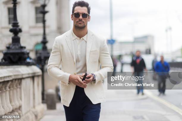 David Gandy wearing a creme jacket, navy pants, polo shirt during the London Fashion Week Men's June 2017 collections on June 12, 2017 in London,...