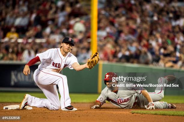 Josh Rutledge of the Boston Red Sox tags out Daniel Nava of the Philadelphia Phillies during the fourth inning of a game on June 12, 2017 at Fenway...
