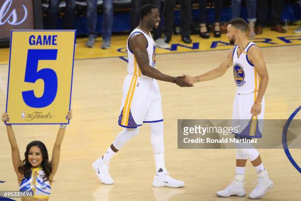 Stephen Curry and Draymond Green of the Golden State Warriors prepare for the opening tip-off in Game 5 of the 2017 NBA Finals against the Cleveland...