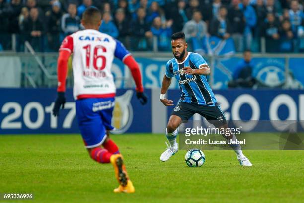 Fernandinho of Gremio battles for the ball against Rodrigo Becao of Bahia during the match between Gremio and Bahia as part of Brasileirao Series A...