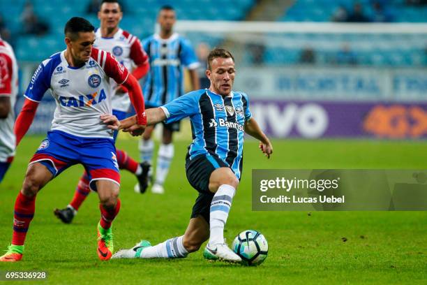 Arthur of Gremio battles for the ball against Juninho of Bahia during the match between Gremio and Bahia as part of Brasileirao Series A 2017, at...