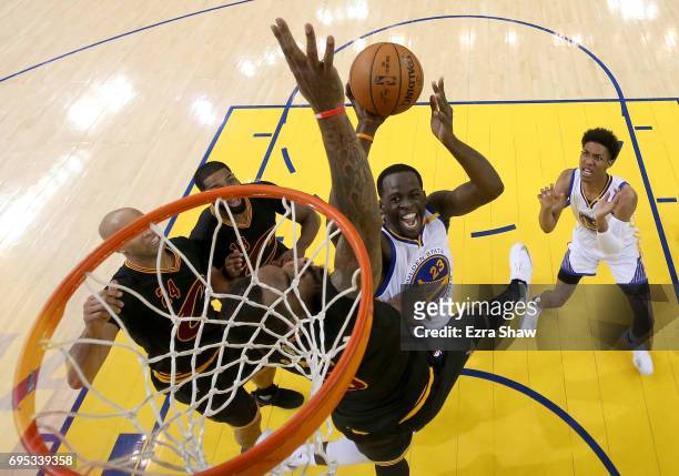 Draymond Green of the Golden State Warriors throws up a shot against JR Smith of the Cleveland Cavaliers in Game 5 of the 2017 NBA Finals at ORACLE...
