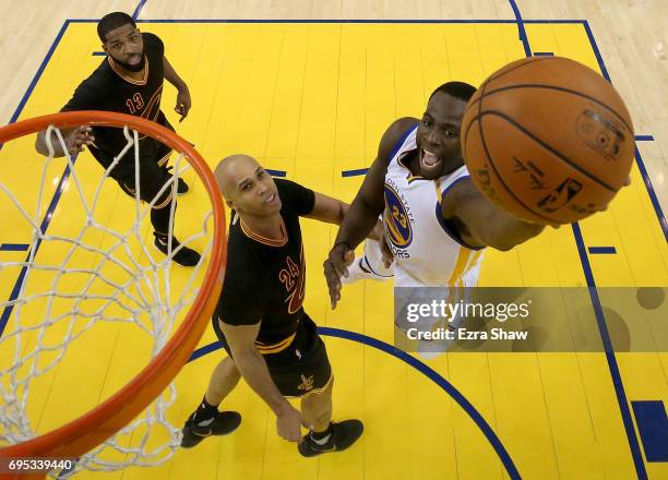 Draymond Green of the Golden State Warriors throws up a shot against Richard Jefferson of the Cleveland Cavaliers in Game 5 of the 2017 NBA Finals at...