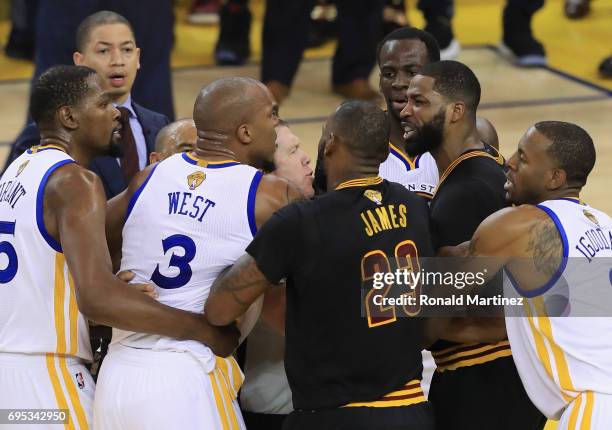 David West of the Golden State Warriors and Tristan Thompson of the Cleveland Cavaliers get into an altercation after a play in Game 5 of the 2017...