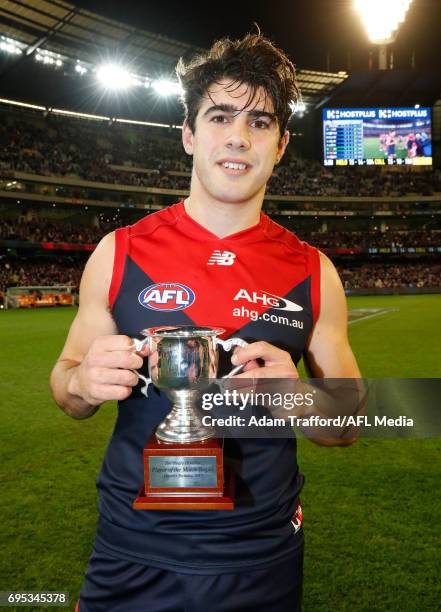 Christian Petracca of the Demons holds the Neale Daniher Trophy for best on ground during the 2017 AFL round 12 match between the Melbourne Demons...