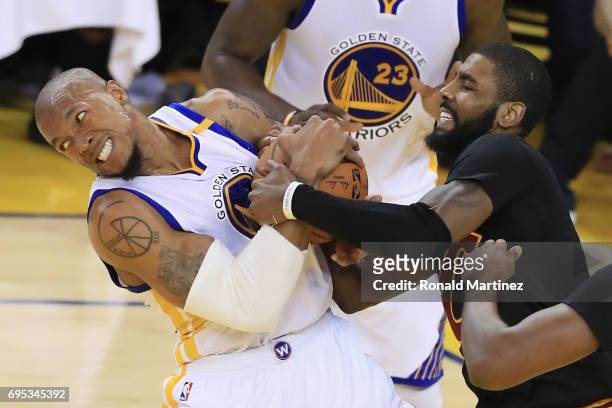David West of the Golden State Warriors and Kyrie Irving of the Cleveland Cavaliers fight for possesion in Game 5 of the 2017 NBA Finals at ORACLE...
