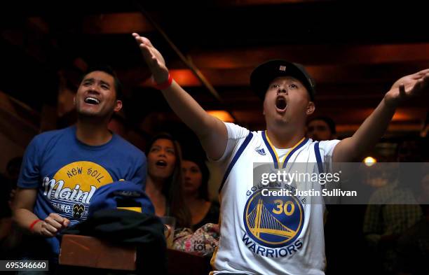 Golden State Warriors fans react as they watch game 5 of the NBA Finals between the Goldens State Warriors and the Cleveland Cavaliers during a watch...