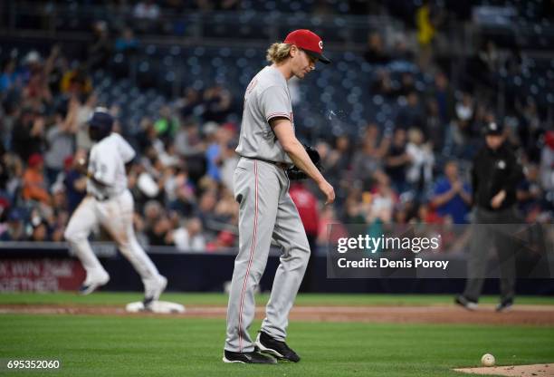 Bronson Arroyo of the Cincinnati Reds looks down after giving up a two-run home run during the second inning of a baseball game against the San Diego...