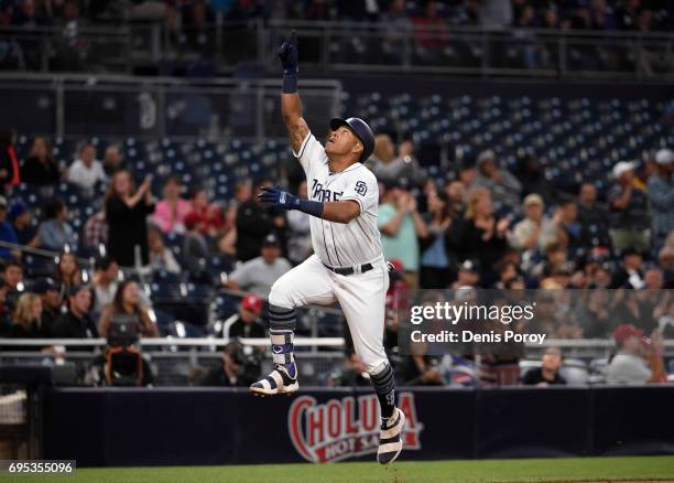 Yangervis Solarte of the San Diego Padres celebrates after hitting a solo home run during the second inning of a baseball game against the Cincinnati...