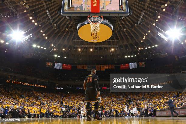LeBron James of the Cleveland Cavaliers stands on the court in Game Five of the 2017 NBA Finals against the Golden State Warriors on June 12, 2017 at...