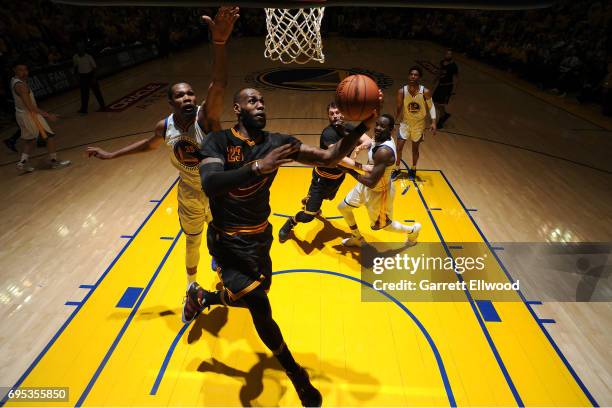 LeBron James of the Cleveland Cavaliers drives to the basket against Kevin Durant of the Golden State Warriors in Game Five of the 2017 NBA Finals on...