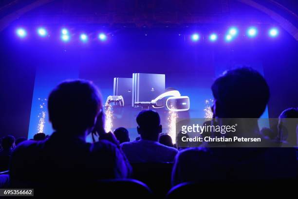 Game enthusiasts and industry personnel attend the Sony Playstation E3 conference at the Shrine Auditorium on June 12, 2017 in Los Angeles,...