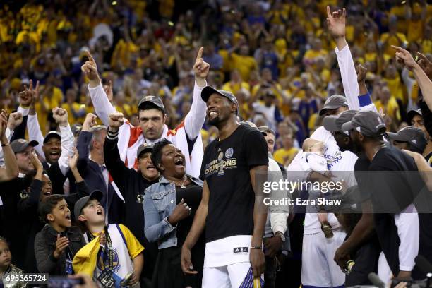 Kevin Durant of the Golden State Warriors celebrates with his mother Wanda after being named Bill Russell NBA Finals Most Valuable Player after...