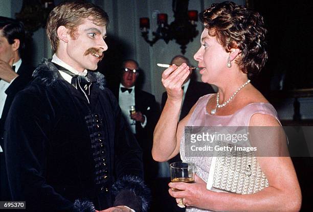 Princess Margaret speaks to Royal Ballet dancer David Wall in 1978 during a Covent Garden Opera House after the premiere of the ballet, "Mayerling."...