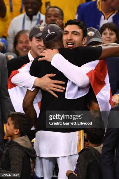 Zaza Pachulia of the Golden State Warriors celebrates with Kevin Durant of the Golden State Warriors after the Warriors defeat the Cleveland...