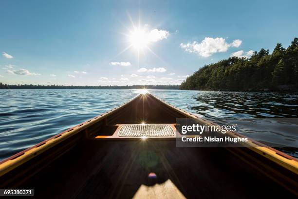 looking out over front of canoe - see saranac lake stock-fotos und bilder