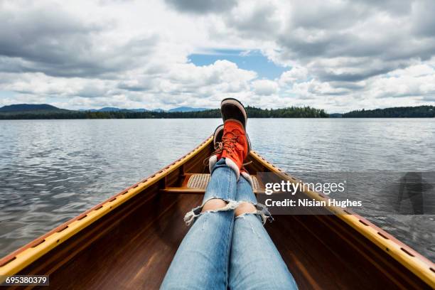 woman sitting in canoe pov looking out - bottines stockfoto's en -beelden