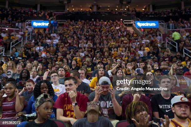 Cleveland Cavaliers fans react as they watch Game 5 of the NBA Finals between the Cleveland Cavaliers and the Golden State Warriors during a watch...