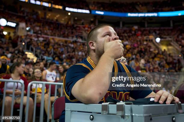 Cleveland Cavaliers fans react as they watch Game 5 of the NBA Finals between the Cleveland Cavaliers and the Golden State Warriors during a watch...