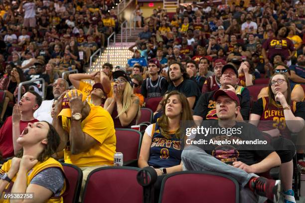 Cleveland Cavaliers fans react as they watch Game 5 of the NBA Finals between the Cleveland Cavaliers and the Golden State Warriors during a watch...