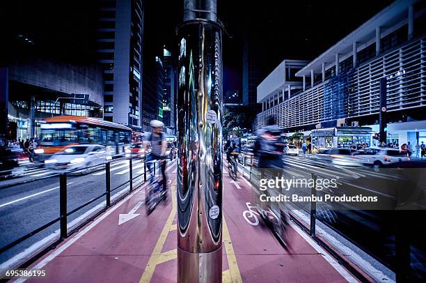 bike line and traffic - são paulo city stock pictures, royalty-free photos & images