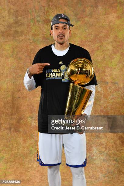 Matt Barnes of the Golden State Warriors poses for a portrait with the Larry O'Brien Trophy after defeating the Cleveland Cavaliers in Game Five of...