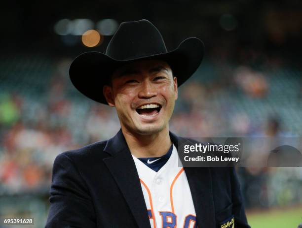Norichika Aoki of the Houston Astros is given a cowboy hat during pre-game ceremony honoring his induction into the Golden Players Club after...
