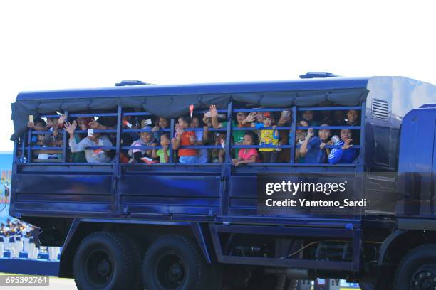 public citizens enthusiastically boarded troop trucks - the-indonesian-national-air-force-parade stock pictures, royalty-free photos & images