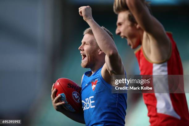 Daniel Hannebery celebrates winning a training drill with his group during a Sydney Swans AFL training session at Sydney Cricket Ground on June 13,...