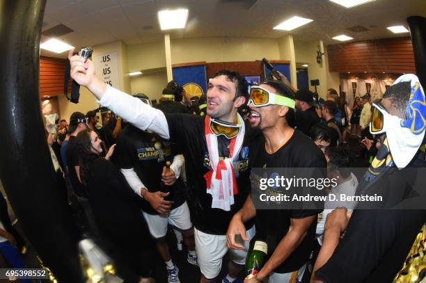 Zaza Pachulia and James Michael McAdoo of the Golden State Warriors celebrate in the locker room after winning the NBA Championship in Game Five of...