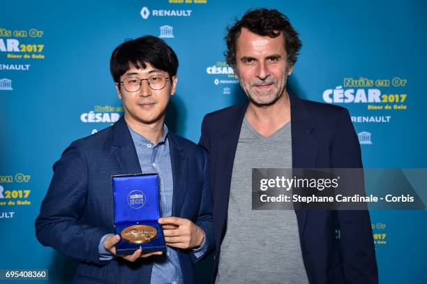 Ji-Won Lee and Eric Lartigau attend 'Les Nuits en Or 2017' Dinner Gala, at Unesco on June 12, 2017 in Paris, France.