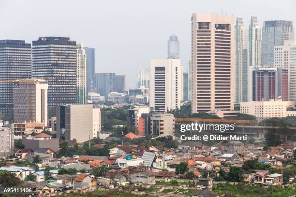 aerial view of jakarta cityscape in indonesia capital city - asymmetric stock pictures, royalty-free photos & images