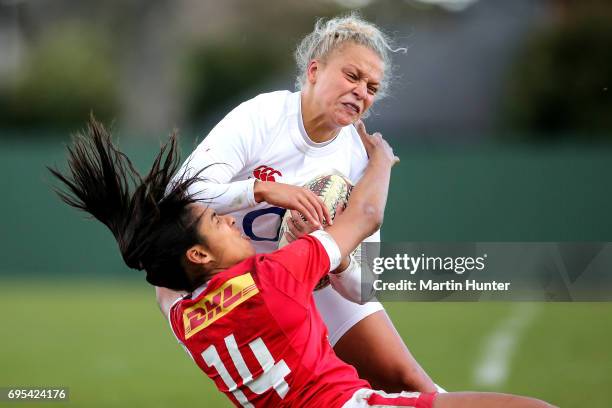 Sarah McKenna of England is tackled by Magali Harvey of Canada during the Women's International Test match between Canada and the England Roses at...