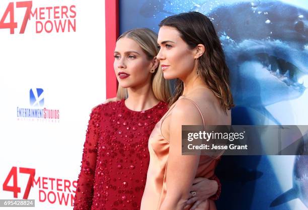 Actresses Claire Holt and Mandy Moore attend the Premiere of Dimension Films' "47 Meters Down" at the Regency Village Theatre on June 12, 2017 in...