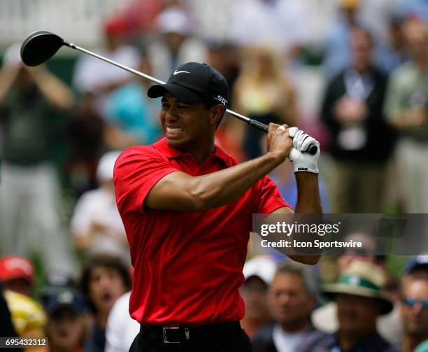 Tiger Woods grimaces in pain after his tee shot on the 2nd hole during the final round of the US Open Championship at Torrey Pines South Golf Course...