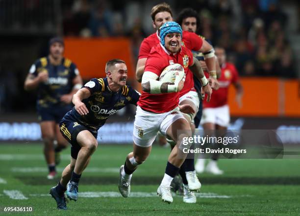 Jack Nowell of the Lions is tackled by Kayne Hammington of the Highlanders during the 2017 British & Irish Lions tour match between the Highlanders...