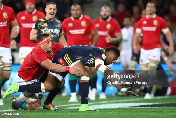 Waisake Naholo of the Highlanders barges through CJ Stander of the Lions to score the opening try during the 2017 British & Irish Lions tour match...