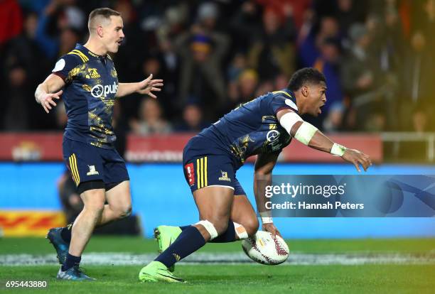 Waisake Naholo of the Highlanders celebrates after scoring the opening try during the 2017 British & Irish Lions tour match between the Highlanders...