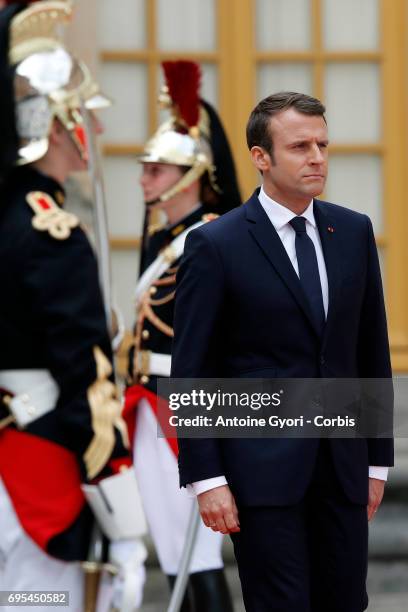 French President Emmanuel Macron waits for Russian President Vladimir Putin prior to their meeting at 'Chateau de Versailles' on May 29, 2017 in...