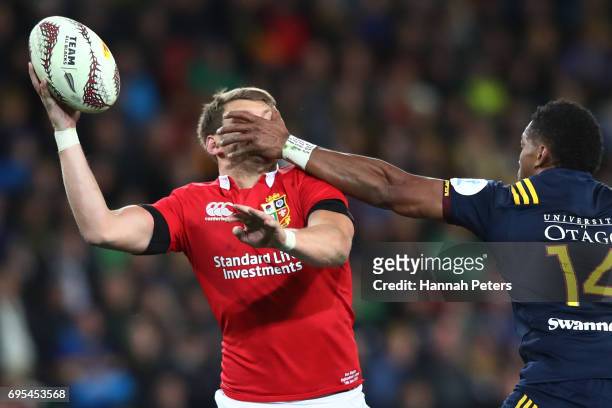 Dan Biggar of the Lions is tackled high by Waisake Naholo of the Highlanders as he offloads during the 2017 British & Irish Lions tour match between...