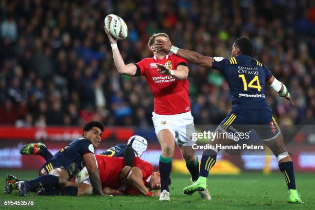 Dan Biggar of the Lions is tackled high by Waisake Naholo of the Highlanders as he offloads during the 2017 British & Irish Lions tour match between...