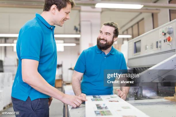 two workers in printing house - printout stock pictures, royalty-free photos & images