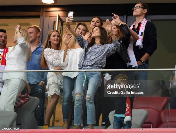 Marina Luczenki of Wojciech Szczesny of Poland, Anna Lewandowska of Valeri Kazaishvili of Legia Warszawa takes a selfie during the 2018 FIFA World...