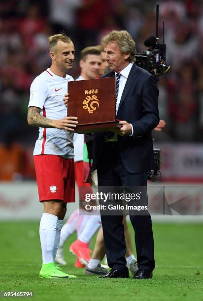 Kamil Grosicki of Poland received a reward after 50th international match from Zbigniew Boniek during the 2018 FIFA World Cup Russia eliminations...